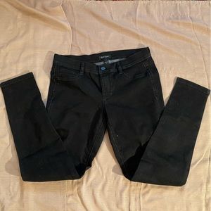 WHBM studded stretch skinny jeans in dark denim. Size M.